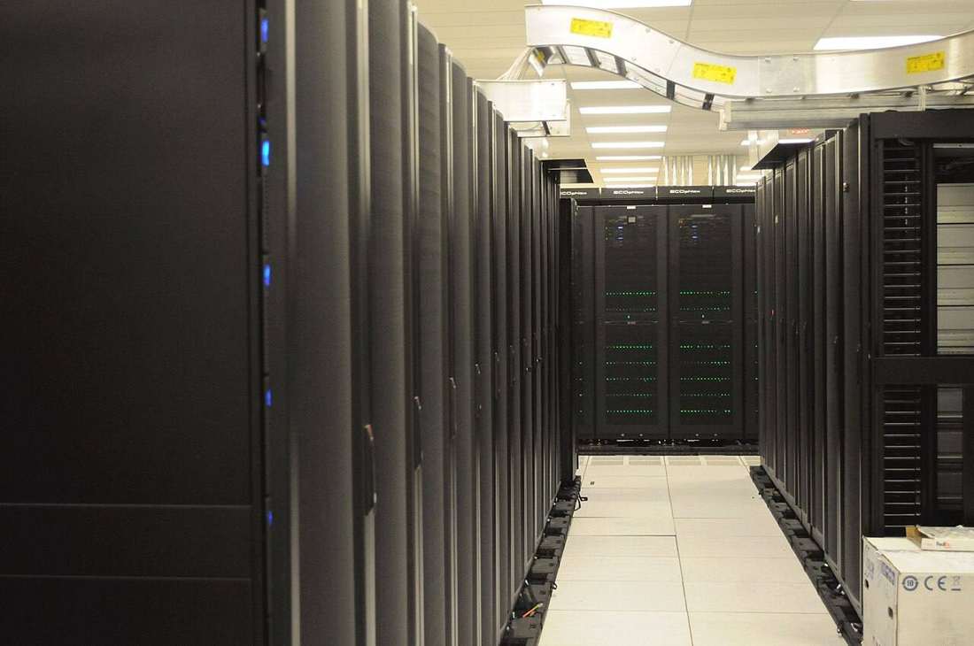 Rows of server racks in a data center hall