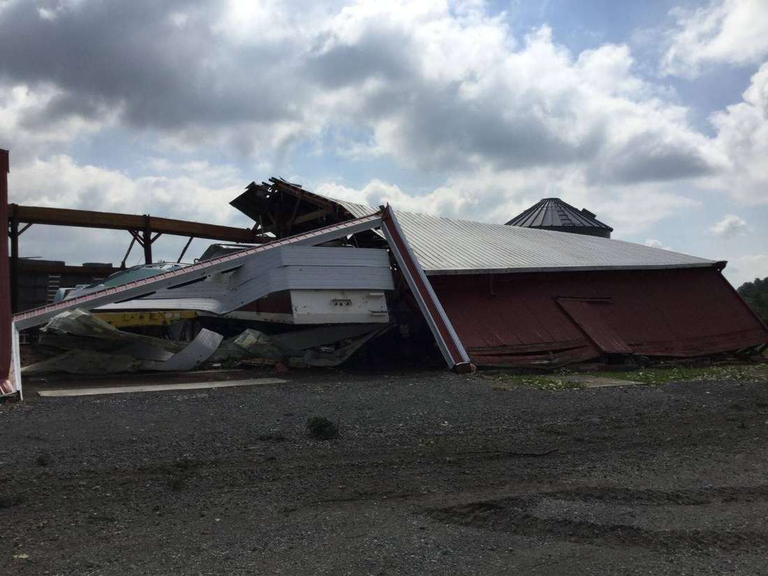 Storm-damaged farm buildings and debris in northern Indiana